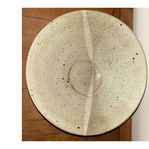 Handmade pottery in cream with brown speckles on it